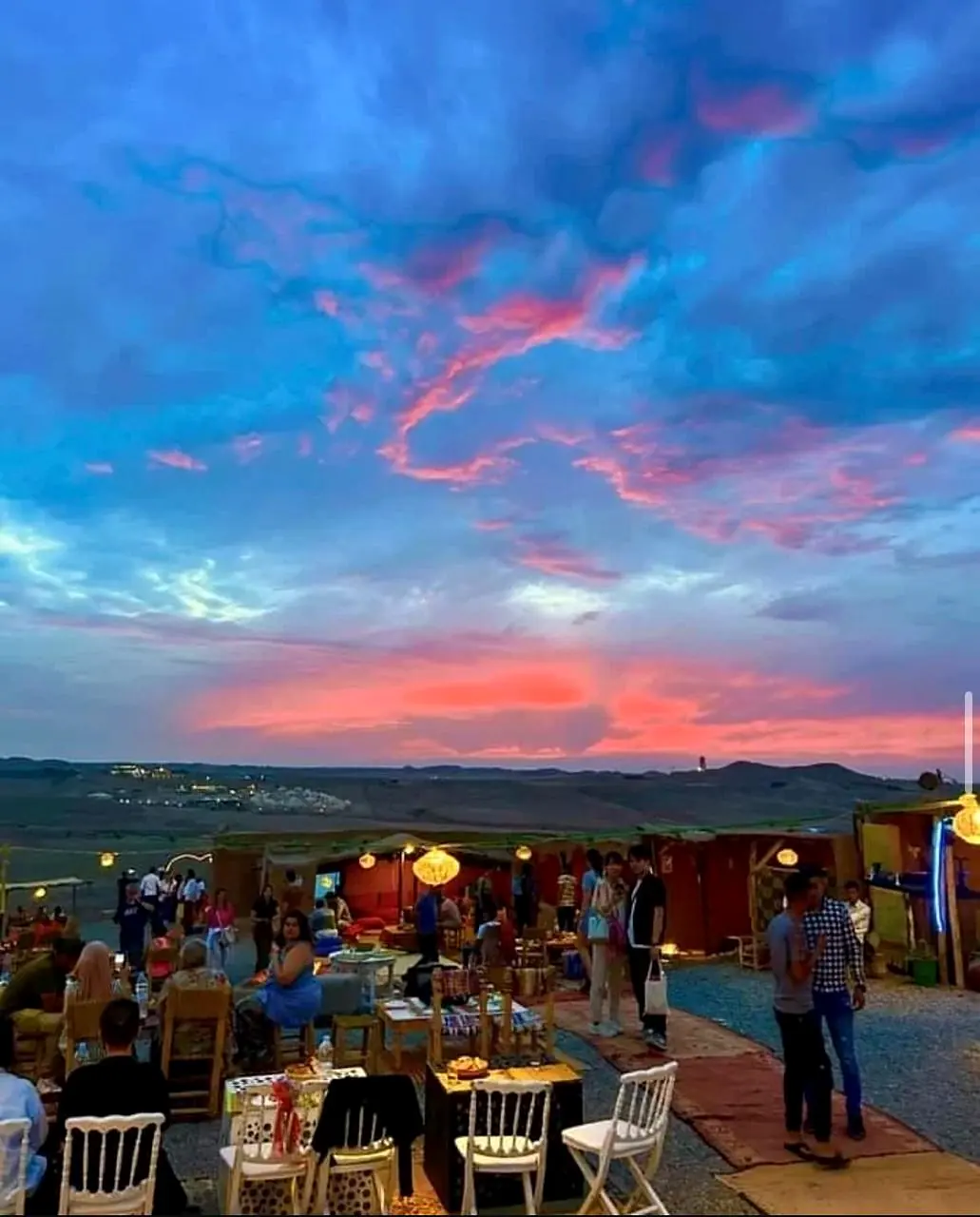 Dinner tables prepared for sunset in the Agafay Desert