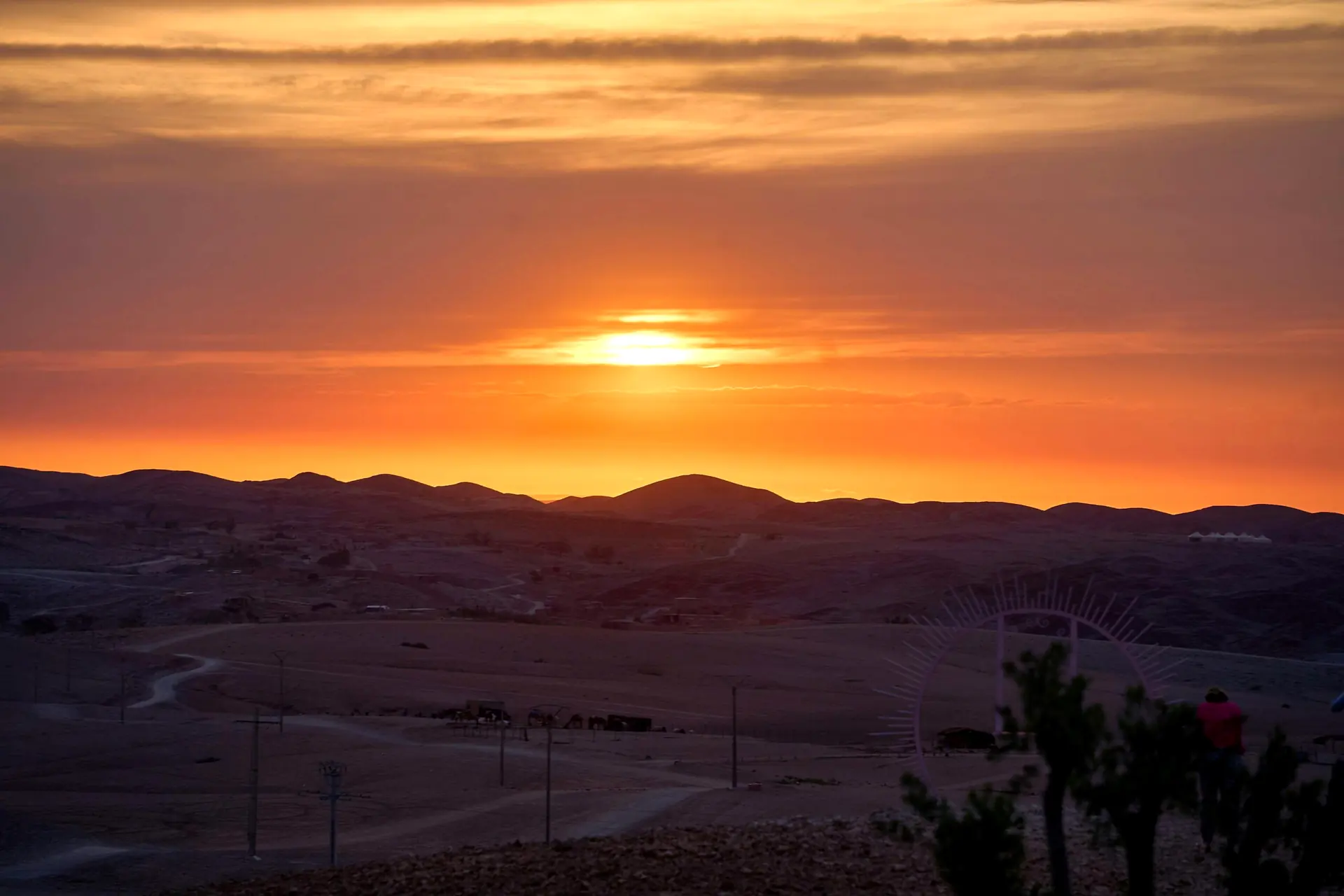Golden sunset over the rocky Agafay Desert near Marrakech